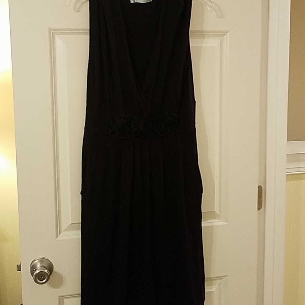 Black sleeveless midi dress.